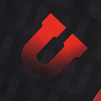 Red 'U' logo on a black textured background